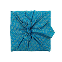 FabRap™ is the premium reusable fabric gift wrap inspired by Japanese furoshiki. Crafted from GOTS-certified organic cotton, our fabric gift wraps replace disposable wrapping paper with a beautiful, reusable and sustainable alternative that transforms gifts into lasting keepsakes and meaningful moments of connection.