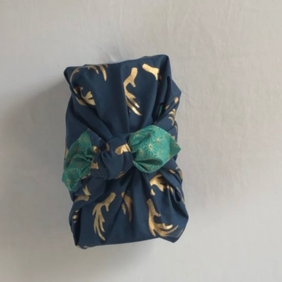 Furoshiki gift wrapping a jug