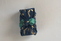 Furoshiki gift wrapping a jug