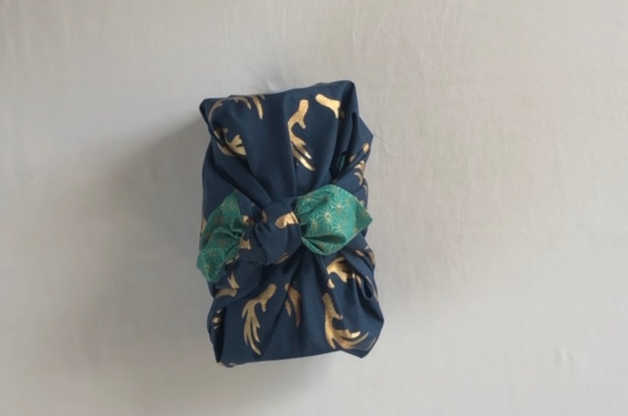 Furoshiki gift wrapping a jug