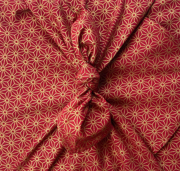 Furoshiki FabRap Reusable fabric gift wrapping. Furoshiki. Ruby red with gold stars design design furoshiki. Exclusive designed furoshiki by FabRap. Zero waste gift wrap by FabRap. FabRap Furoshiki. FabRap fabric gift wrapping.