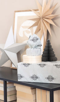 Furoshiki FabRap Reusable fabric gift wrapping. Furoshiki. White with black print starburst design design furoshiki. Exclusive designed furoshiki by FabRap. Zero waste gift wrap by FabRap. FabRap Furoshiki. FabRap fabric gift wrapping.